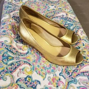Cole Haan peep toe shoes.